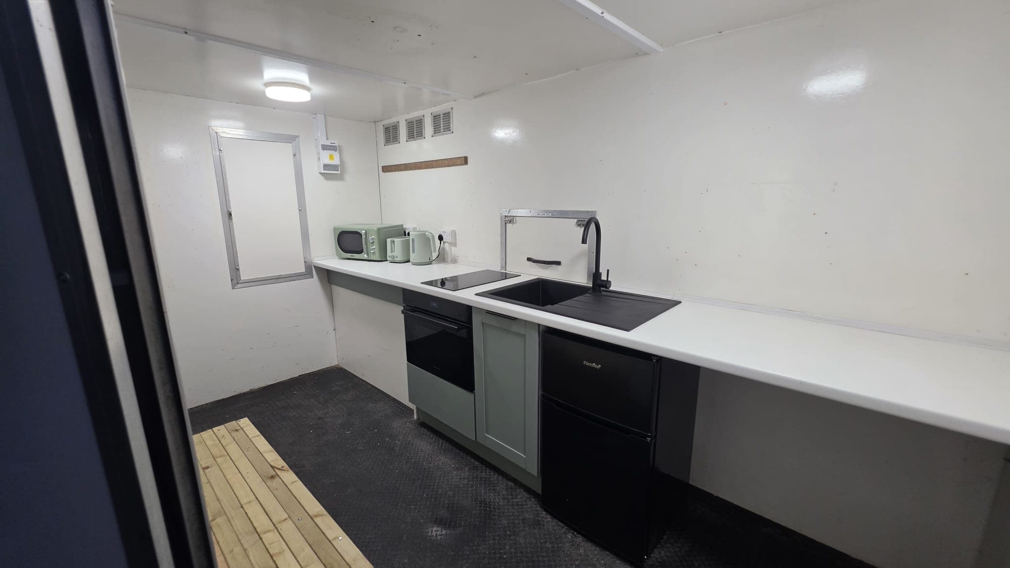 The kitchen seen from the trailer doorway.